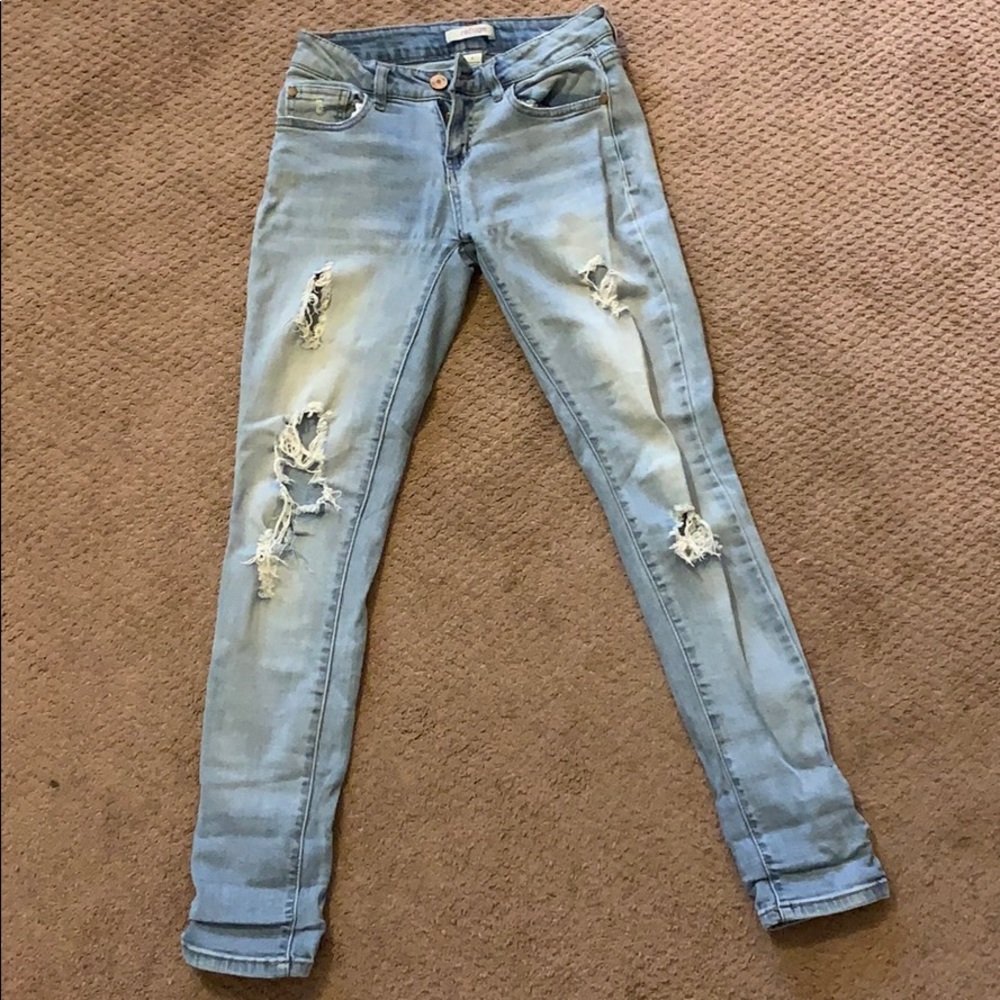 Light blue ripped jeans